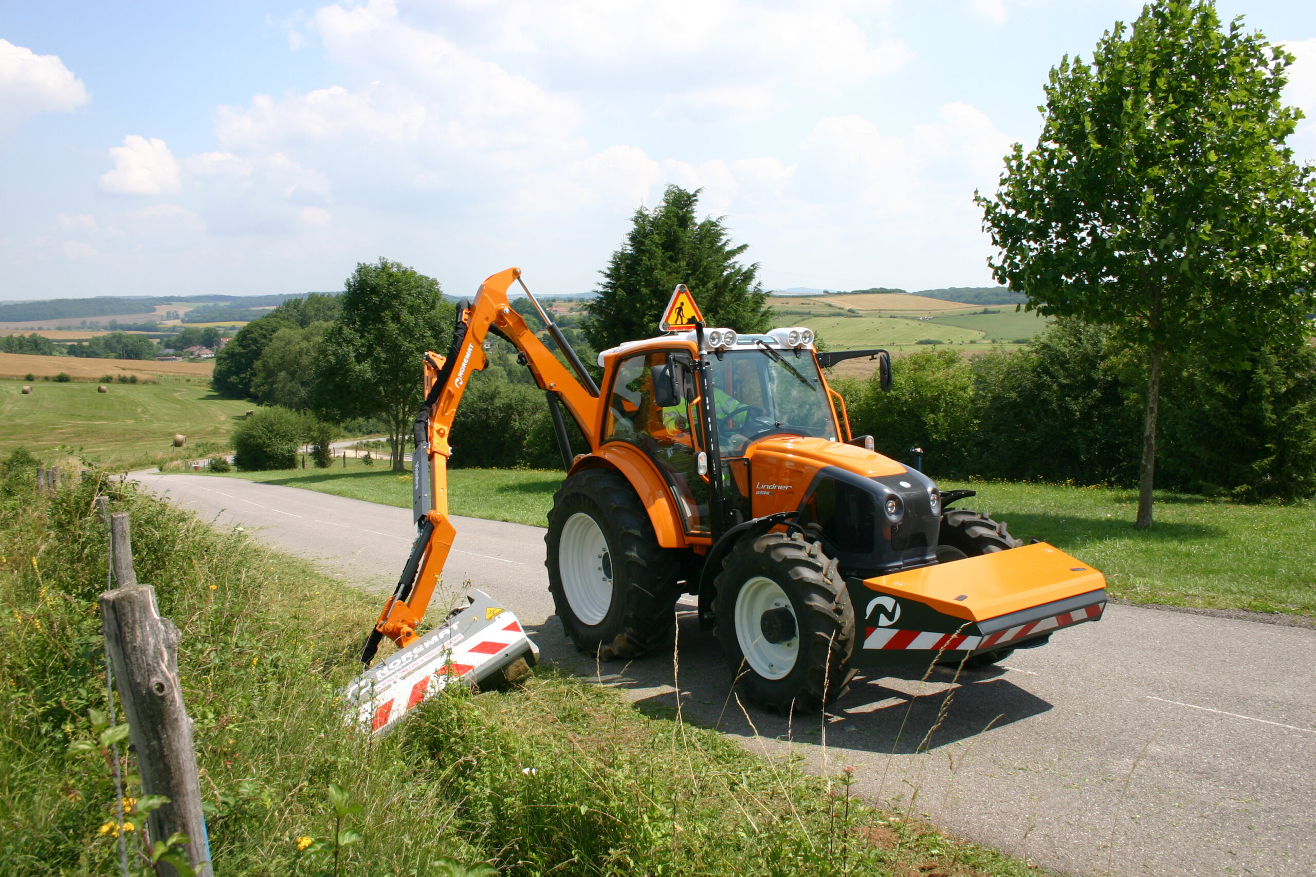 Ensembles tracteurs équipés de bras entre 5 et 6 m
